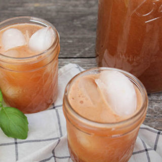upclose shot of watermelon basil lemonade in a mason jar