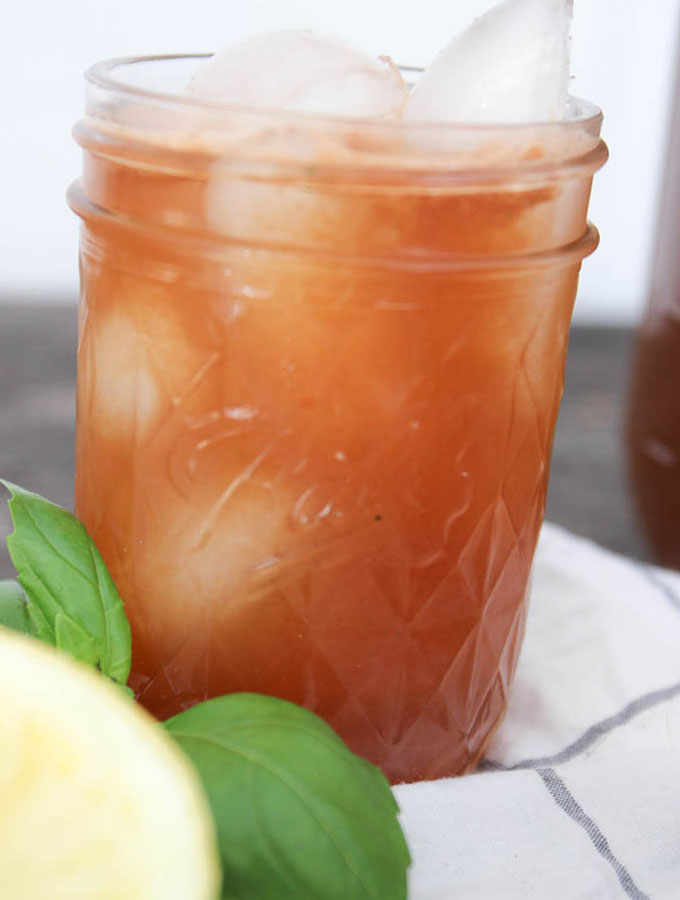 close up shot of a glass of iced refined sugar free basil watermelon lemonade