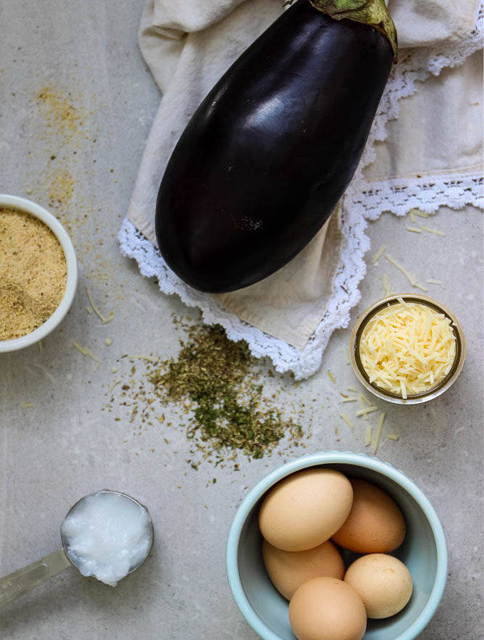 Baked and Crispy eggplant slices have simple ingredients like eggplant, parmesan cheese, egg, breadcrumbs, and Italian seasoning.