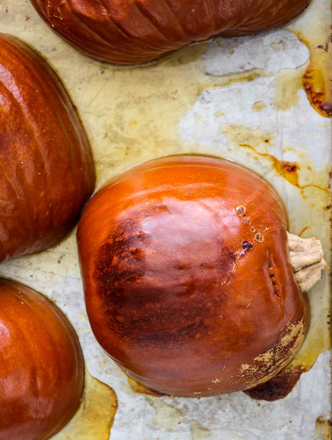 Pumpkin puree is made easily by roasting sugar pie pumpkins in the oven, then blending the pumpkins in a blender.