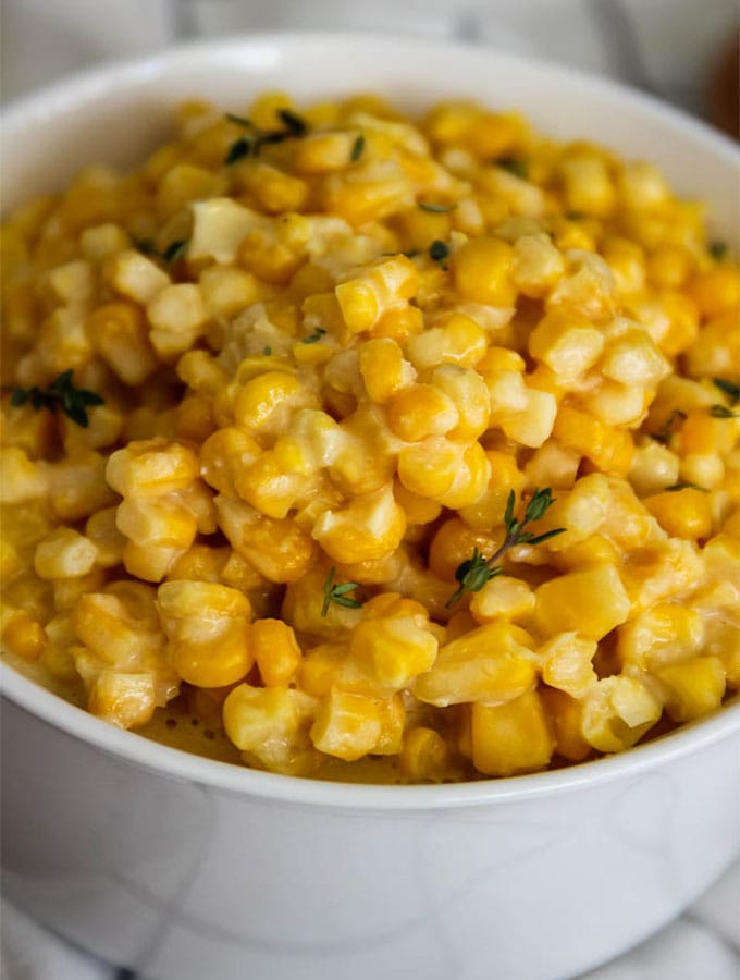 Easy 10 minute stove top creamed corn with garlic and parmesan is a must have side dish! via @foodhussy