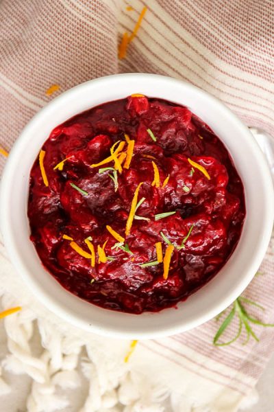 Cranberry sauce is topped with orange zest for added color, texture, and flavor