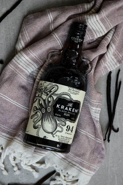 Vanilla extract is made easily by slicing the vanilla beans in half and placing htem in Kraken Black Spiced Rum to begin the extraction.