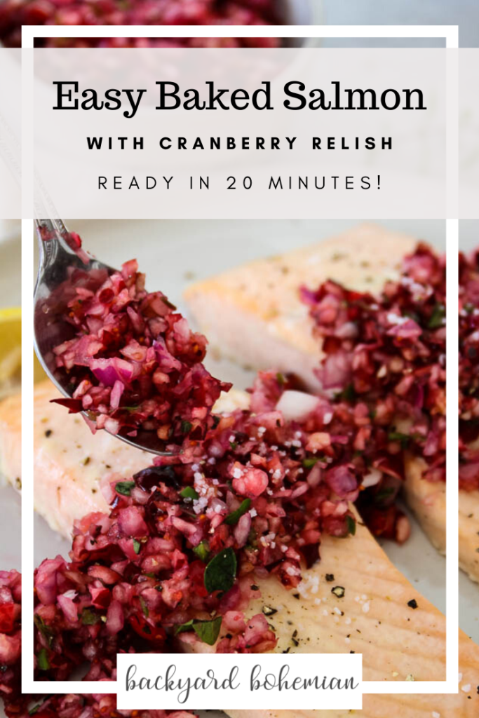 Baked salmon is topped with a fresh cranberry relish with a spoonful of the relish.