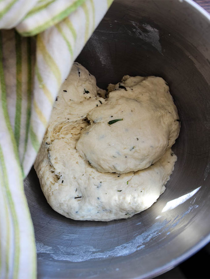 Rosemary Garlic Dinner Rolls are in a mixing bowl and ready to rise.