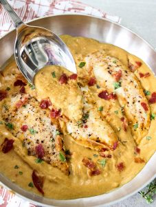 Dijon mustard chicken is topped with more sauce to show the creamy texture.