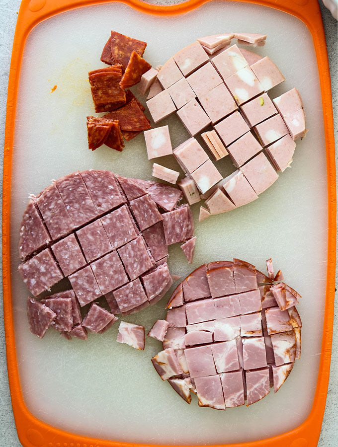 Italian meats are diced into small bite sized pieces.