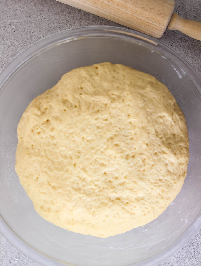 Beignet dough is doubled after 2 hours of rising.