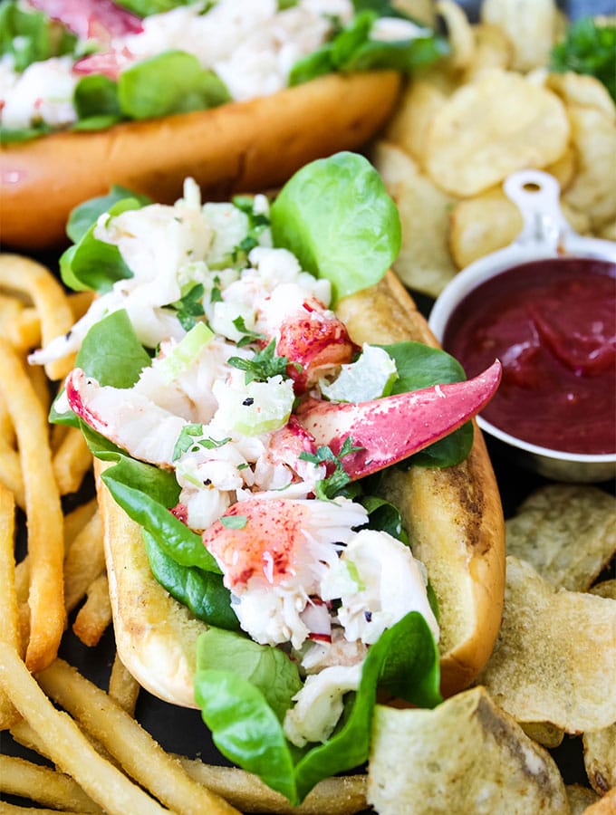 Lobster rolls are stuffed with the lobster mixture, then served with fried and ketchup.