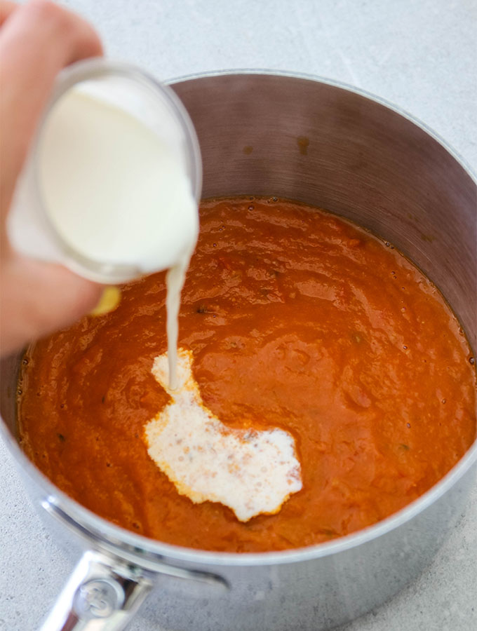 Cream is added to the tomato bisque to rehydrate it.
