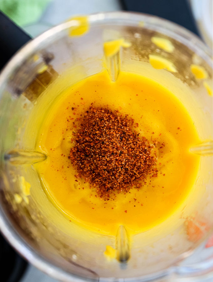 Mango is pureed in a blender with lime juice and sweetener.