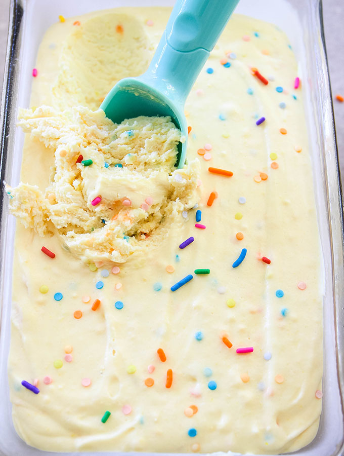 No Churn Cake Batter Ice Cream is scooped with an ice cream scooper.