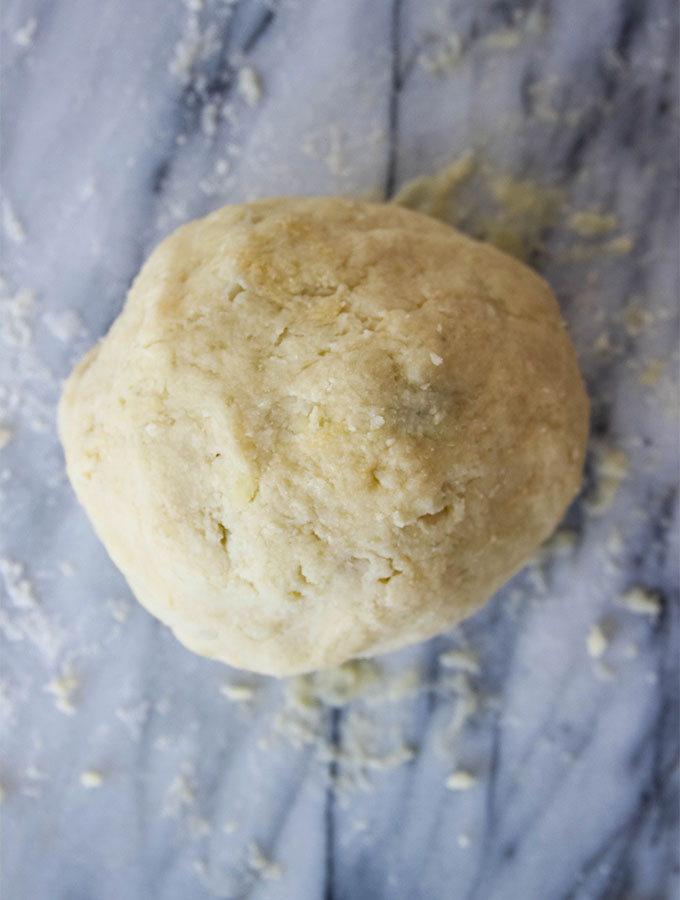 Homemade Italian Gnocchi dough is rolled into a ball.