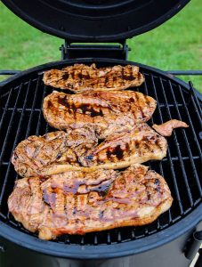 Grilled Sweet Tea Pork Chops are thrown on the grill and cooked to 160 degrees.