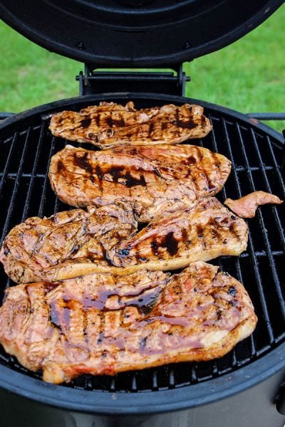 Grilled Sweet Tea Pork Chops are thrown on the grill and cooked to 160 degrees.
