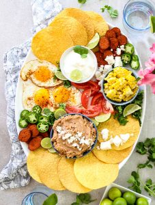 Mexican Tostada Breakfast Board is made with tostadas, chorizo sausage, refried beans, and more fresh ingredients.