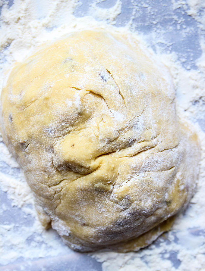 Orange Pistachio Biscotti dough is mixed, then poured on a floured surface.