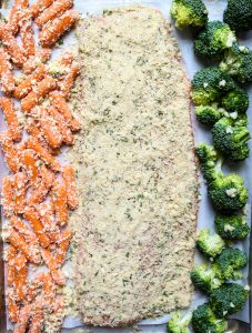 Salmon is cooked on the same sheet pan with the broccoli and carrots for an easy and fast meal.