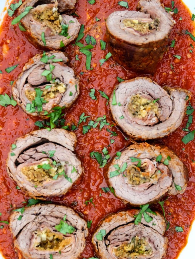 rolled and filled steak meat in a red sauce