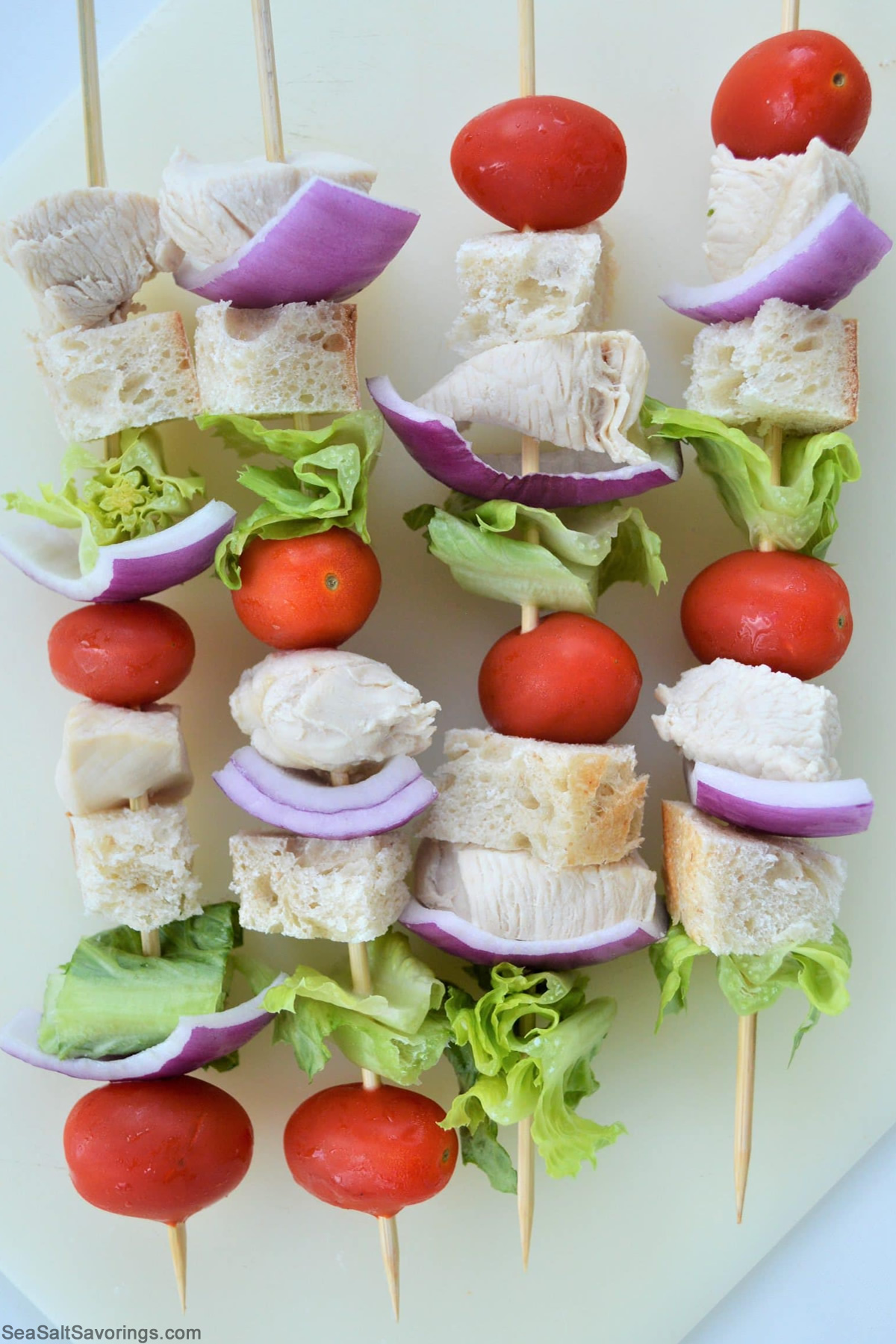 caesar skewers on sticks ready to grill