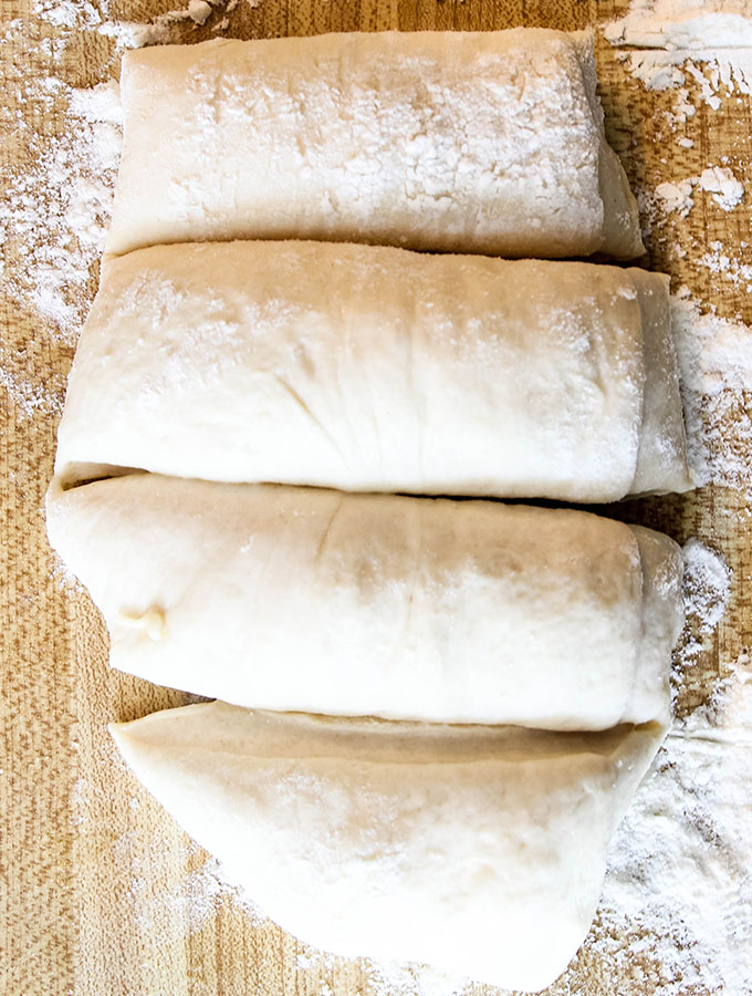 The French bread rolls are divided to make small bread rolls before they are baked.