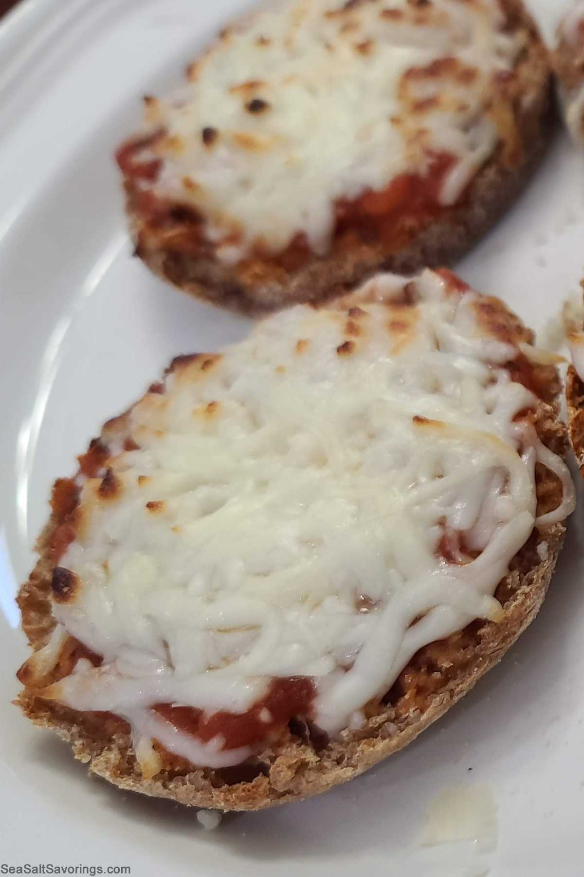 english muffins topped with pizza sauce and cheese