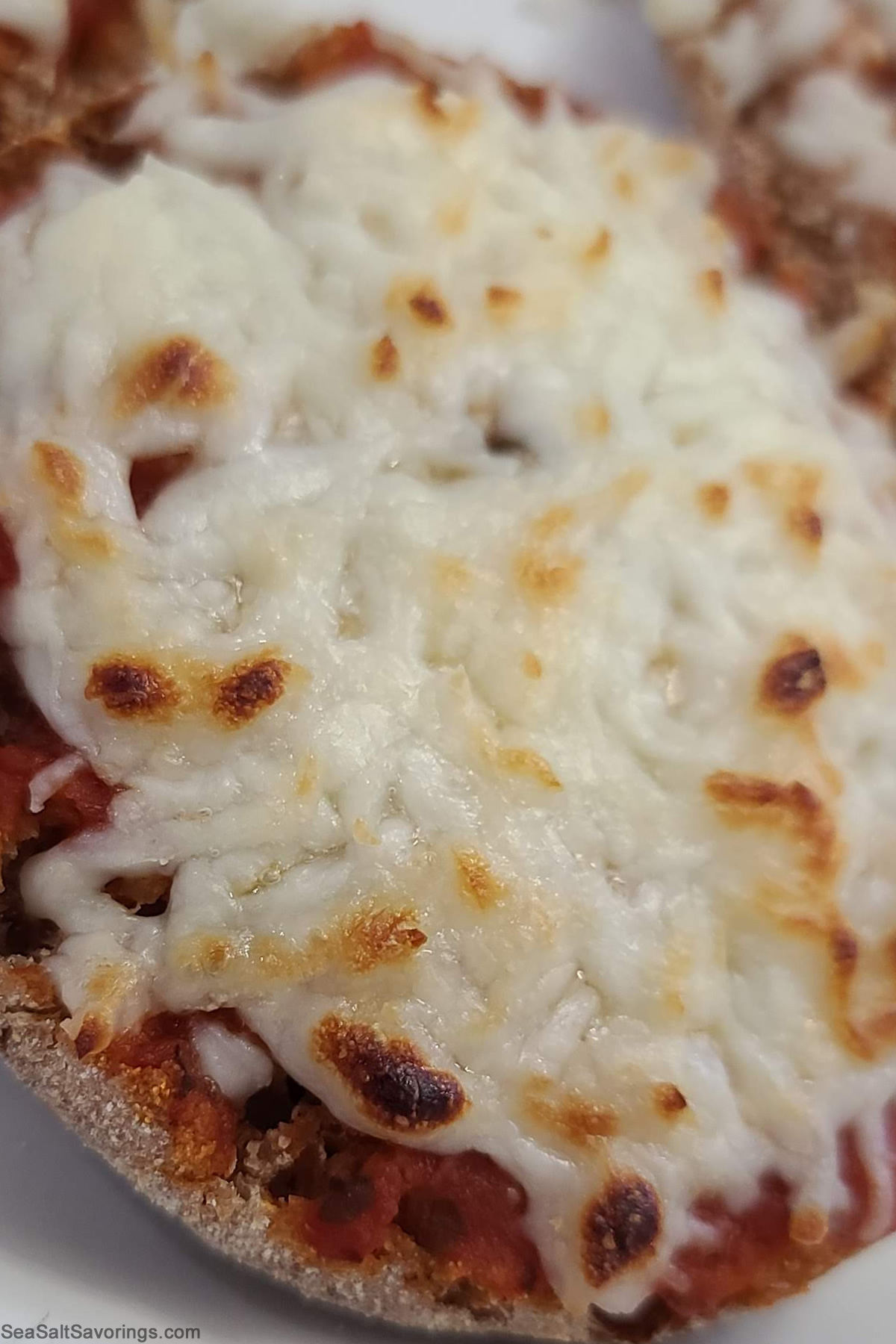 english muffins topped with pizza sauce and cheese