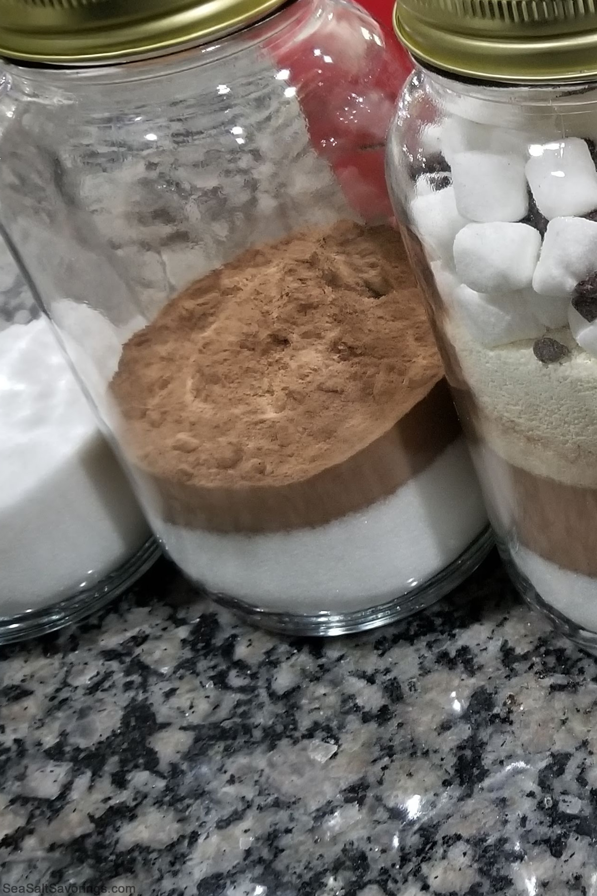 cocoa in jars showing various stages of filling