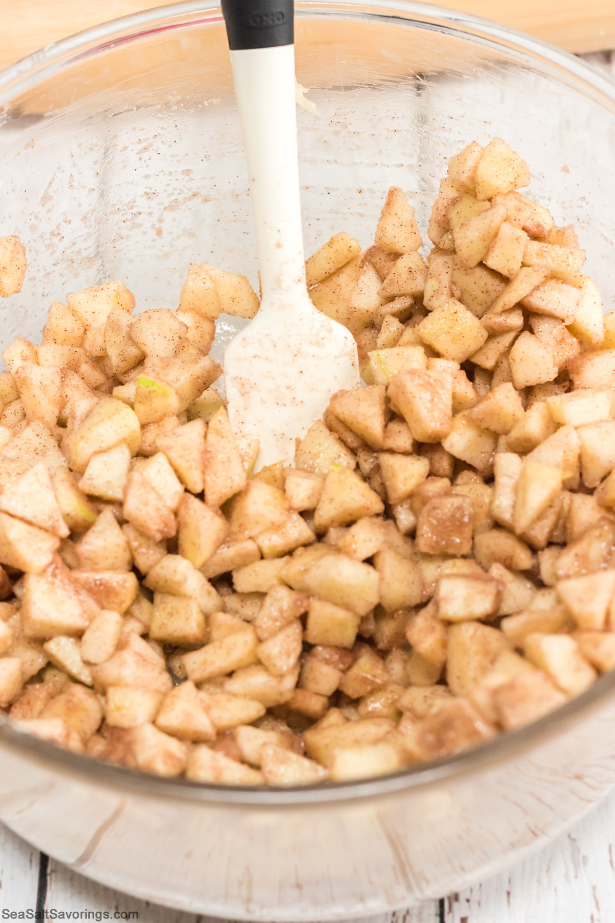 mixing bowl full of sliced apples