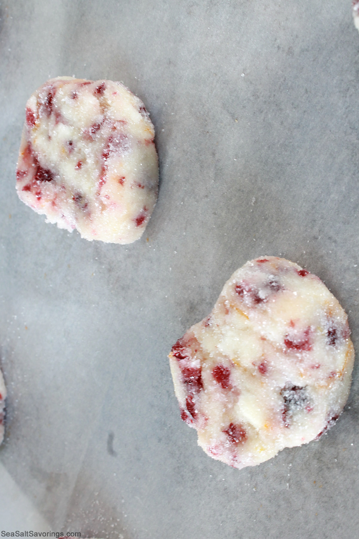 cookie dough balls plopped on a cookie sheet