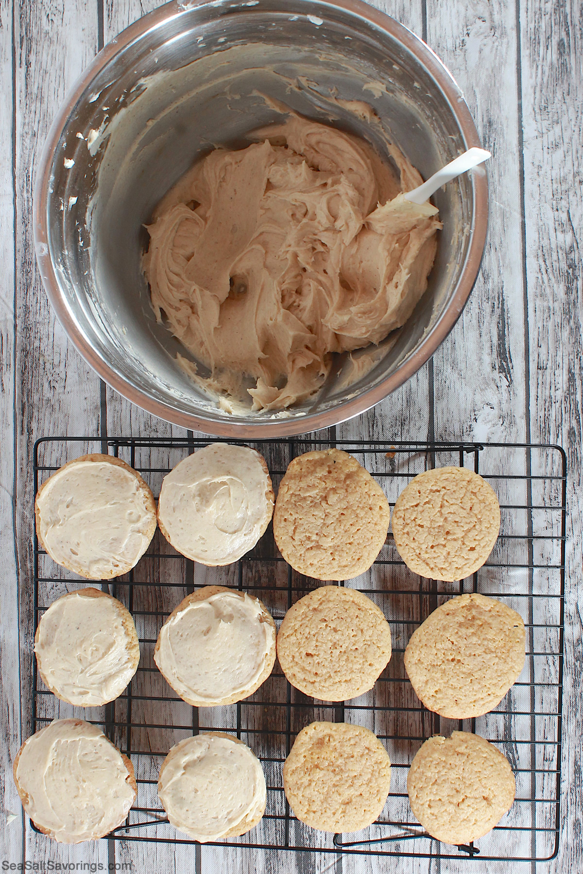 frosting tops of cooked cookies