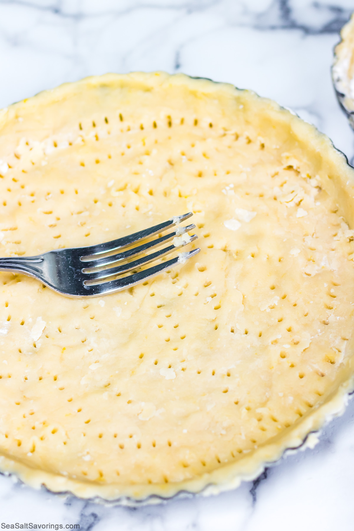 poking holes in crust with fork