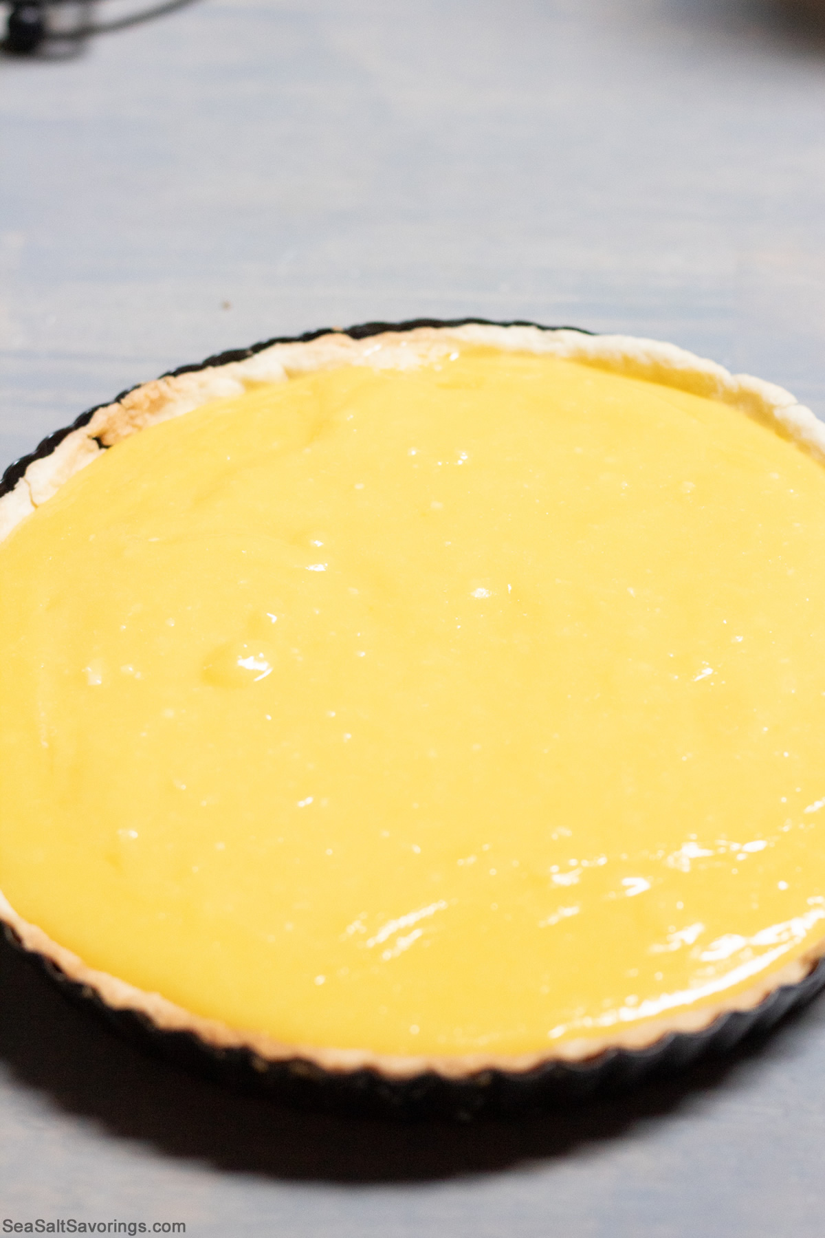 poured custard filling in pie crust