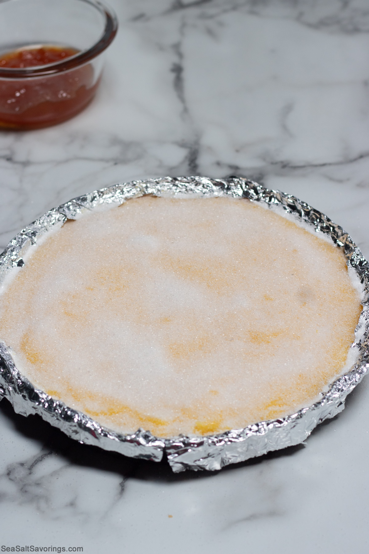 sugar is on top of tart pie and ready to be carmelized