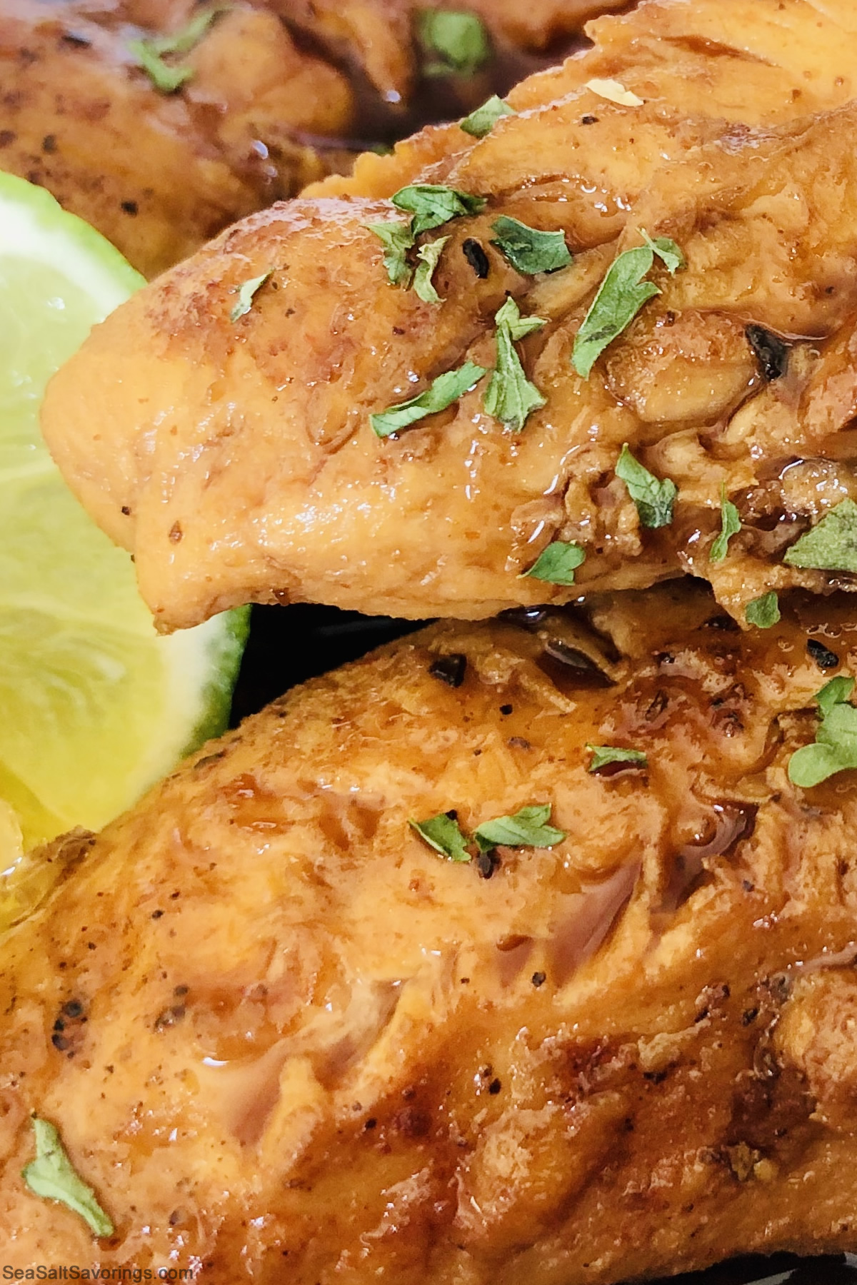 close up view of honey rum chicken that shows the fine details of juiciness