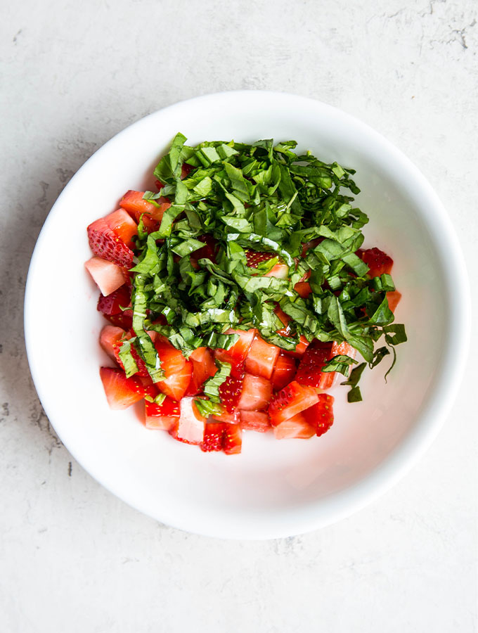 Strawberry relish is made with fresh strawberries, basil, olive oil, and a splash of vinegar.