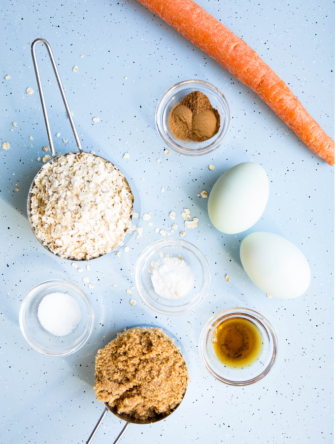 Carrot cake breakfast bar ingredients include oats, sugar, a fresh carrot, and a few more.