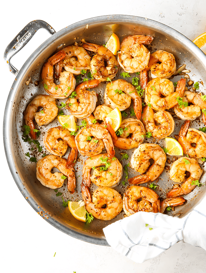 overhead view of frying pan with cooked shrimps