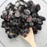 Blackberries are tossed with sugar and lemon juice.