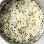 Coconut rice is made in one pot with jasmine rice, cilantro, lime juice, and water.