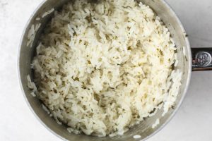 Coconut rice is made in one pot with jasmine rice, cilantro, lime juice, and water.