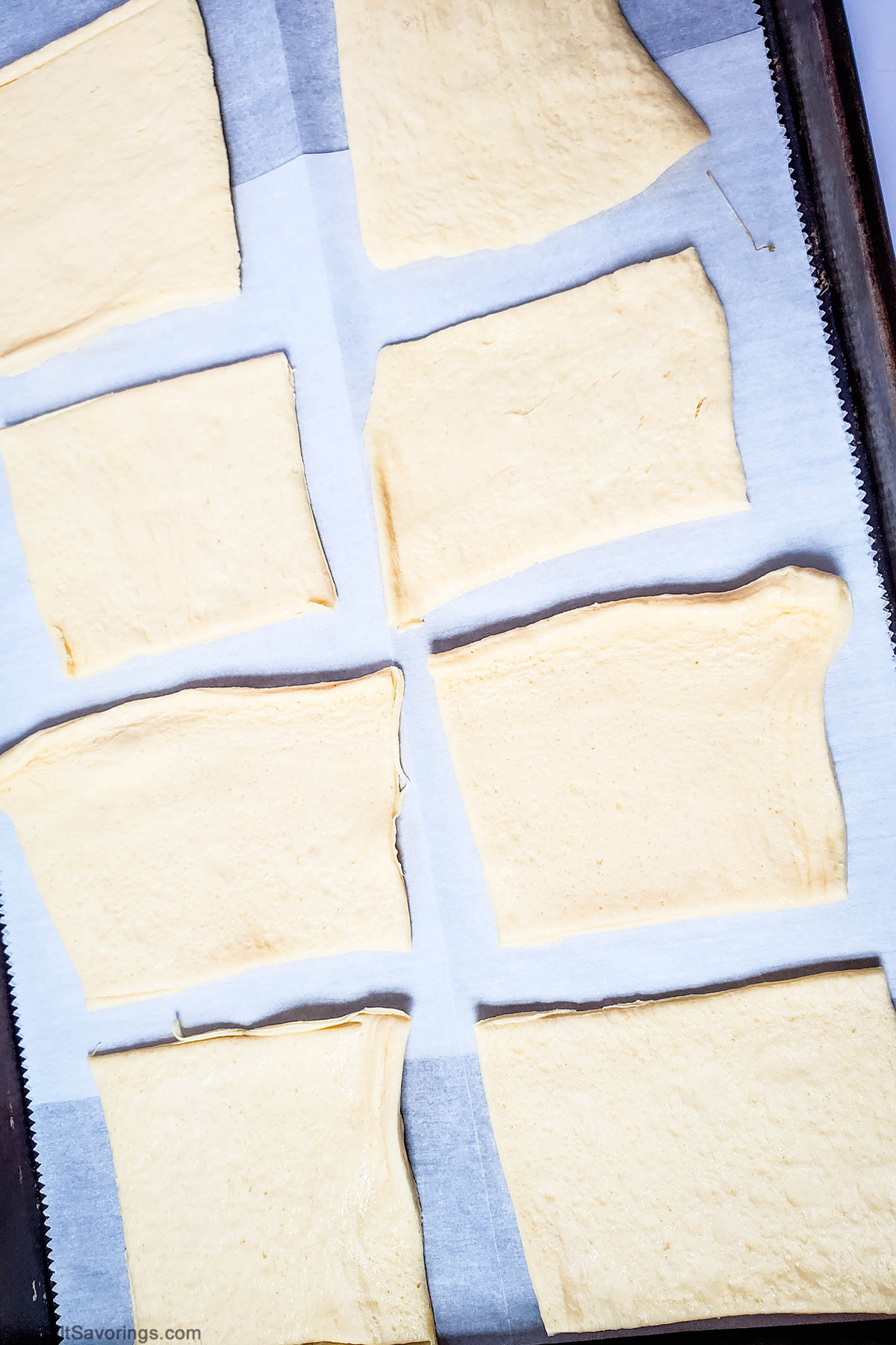 dough flattened into squares