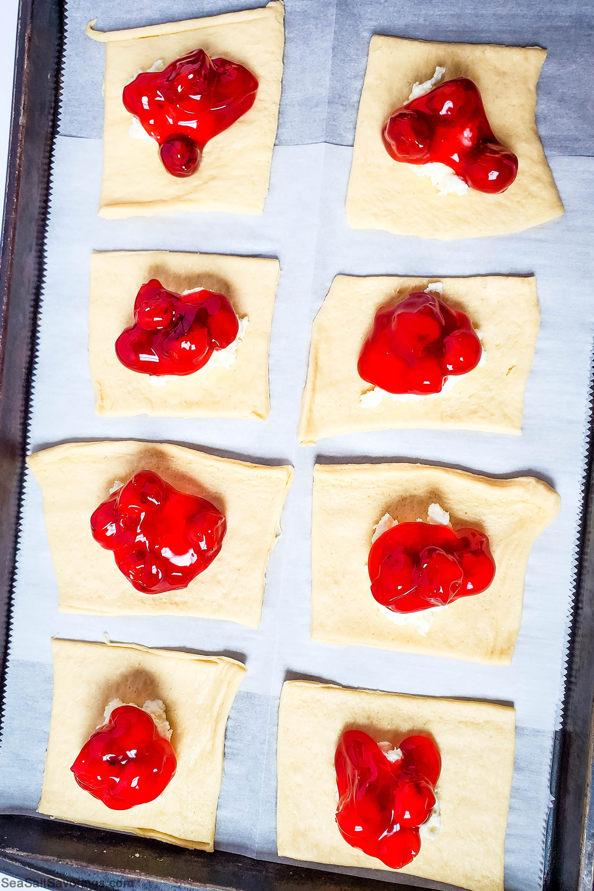 cherry pie filling plopped on top of cheese