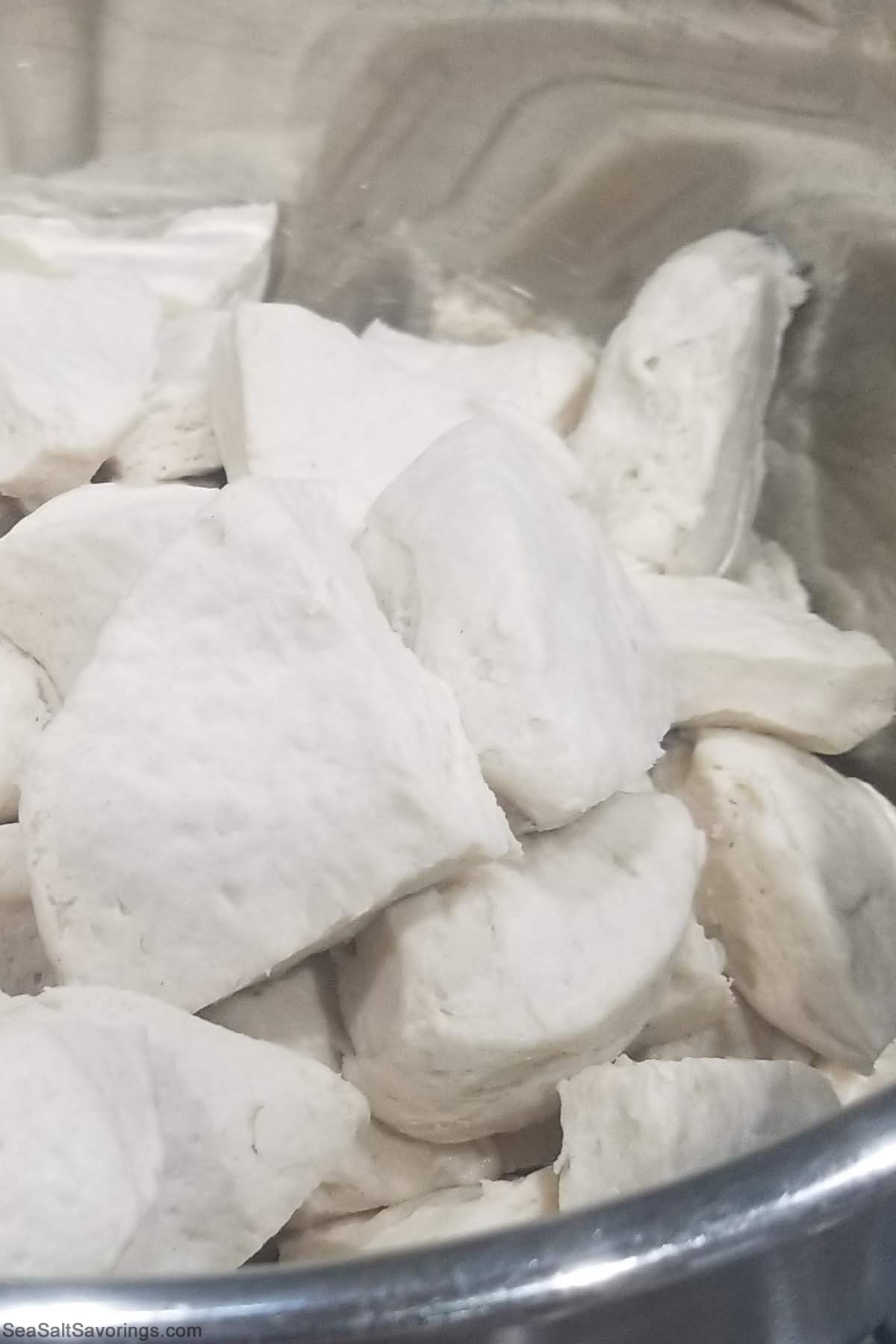 bread chunks in a metal baking dish