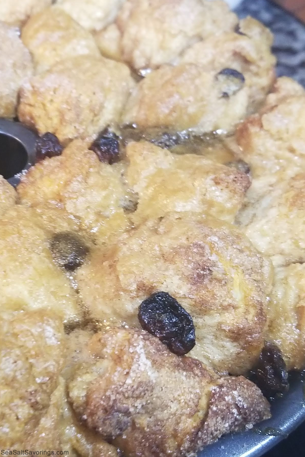 cooked monkey bread expanding a little bit outside the bundt pan