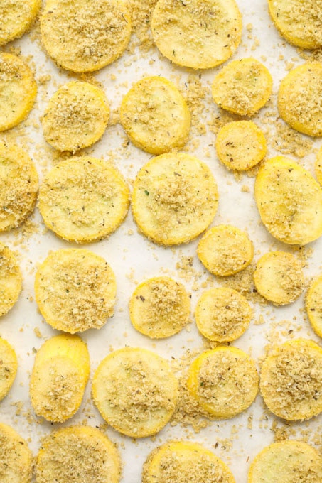 The summer squash is tossed in the herbed bread crumbs and placed in a single layer on a baking sheet.