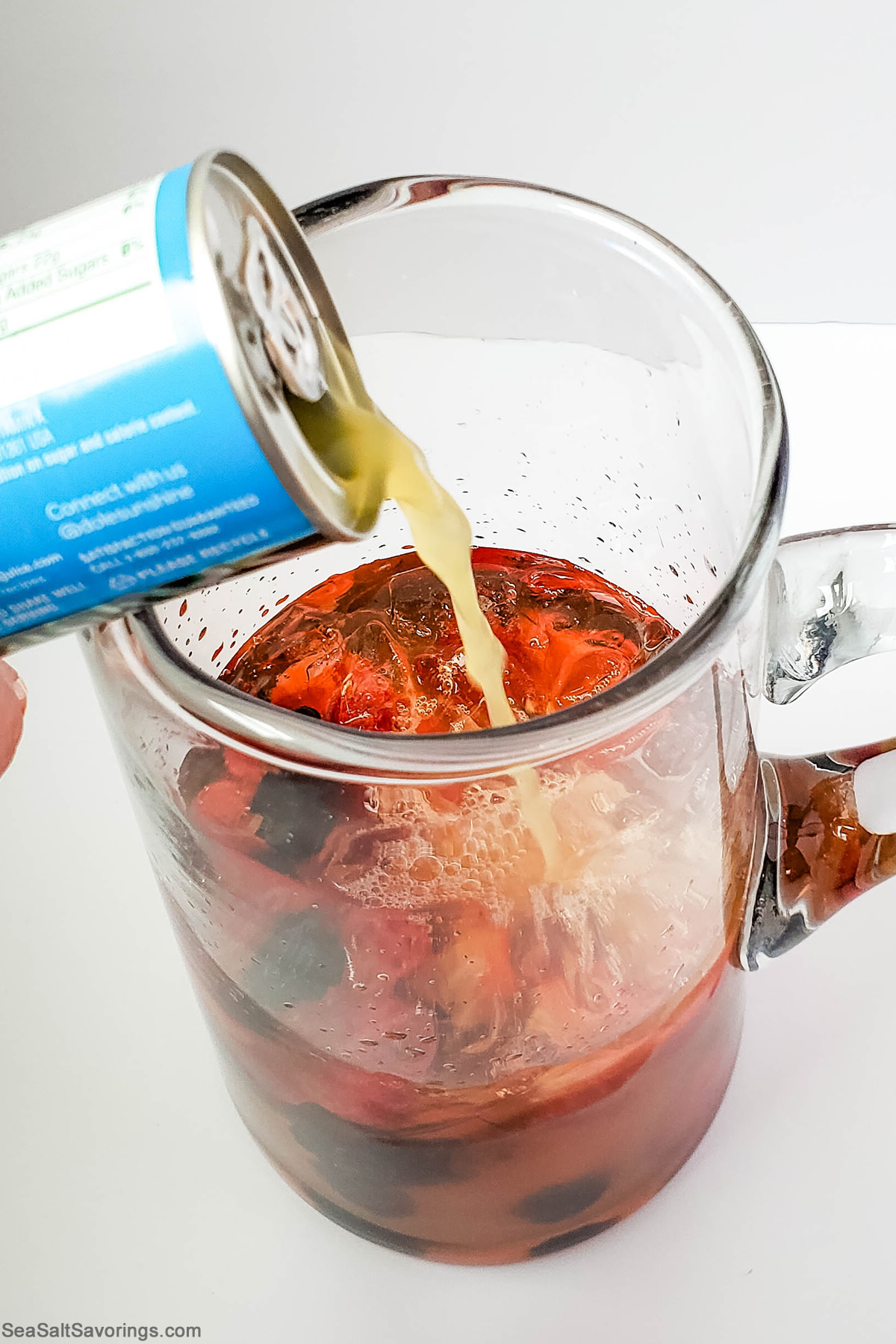 pouring fruit juice in cup