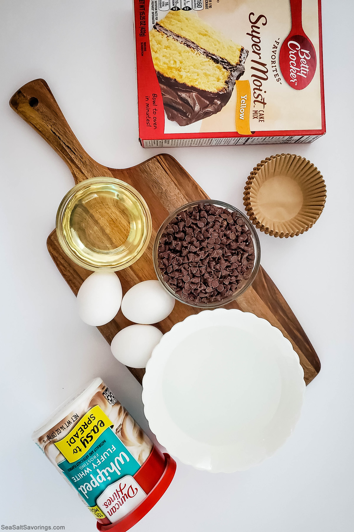 ingredients in bowls for chocolate chip cupcakes