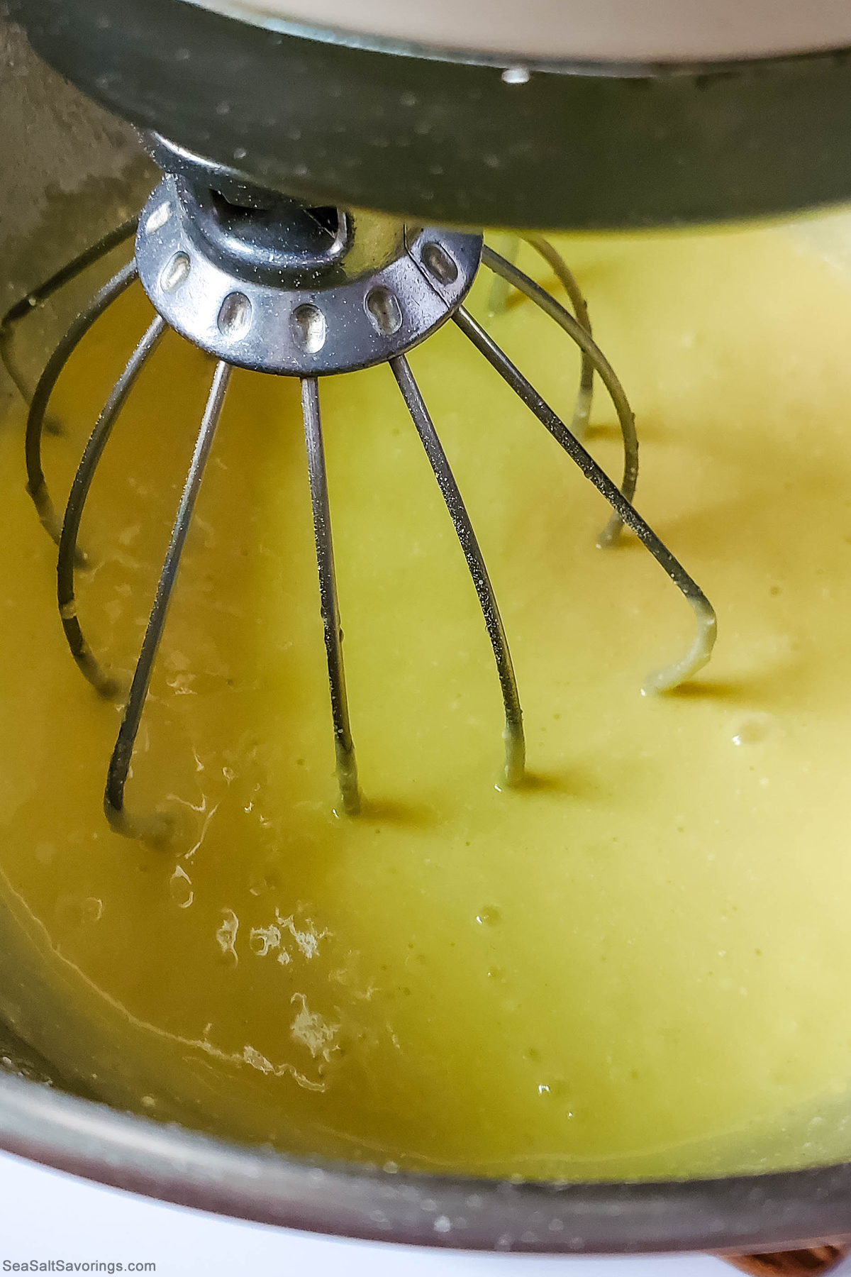 whisp mixing ingredients to make batter