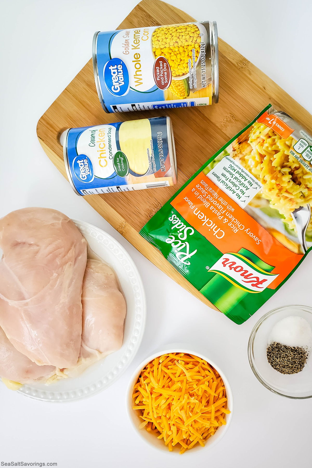 ingredients for chicken and rice recipe, including a package of rice and a chicken